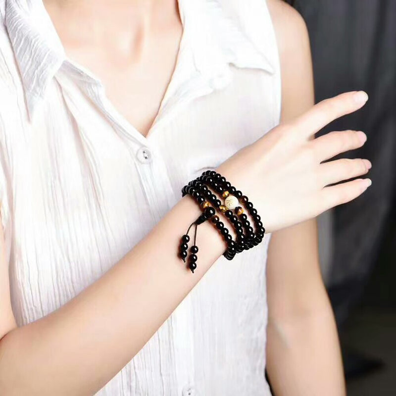Bracelet Mala fluorescent avec une perle décoré d&