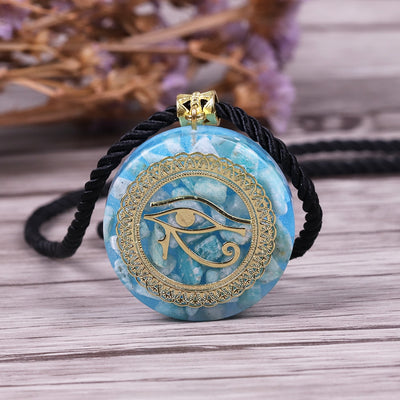 collier bleu turquoise œil d'horus avec ornement plaqué or et cordon tressé