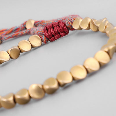 Bracelet traditionnel bouddhiste en perles de cuivre