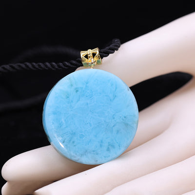 collier bleu turquoise œil d'horus avec ornement plaqué or et cordon tressé