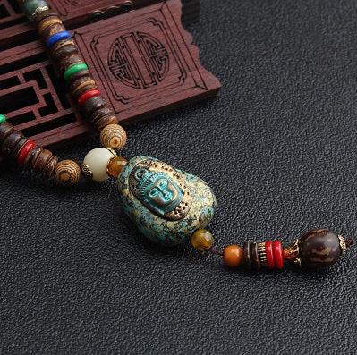 Collier long tête de bouddha